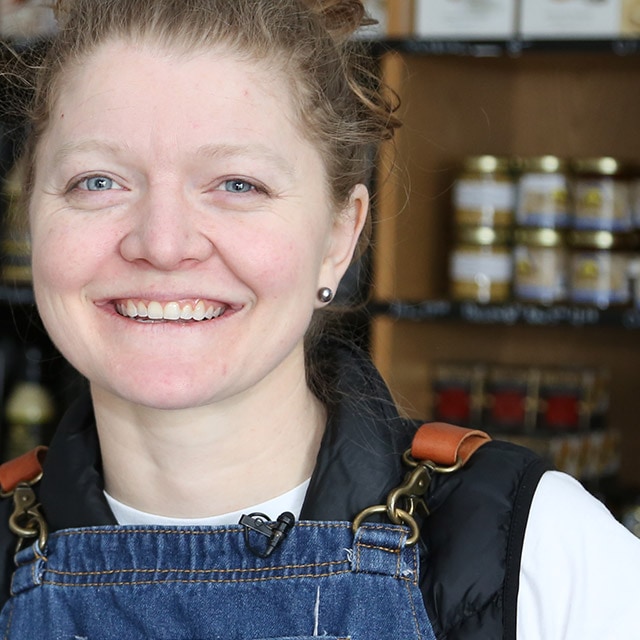 A woman smiling.