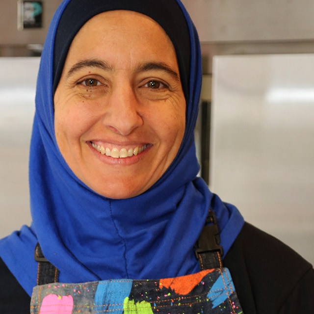 A woman smiling.